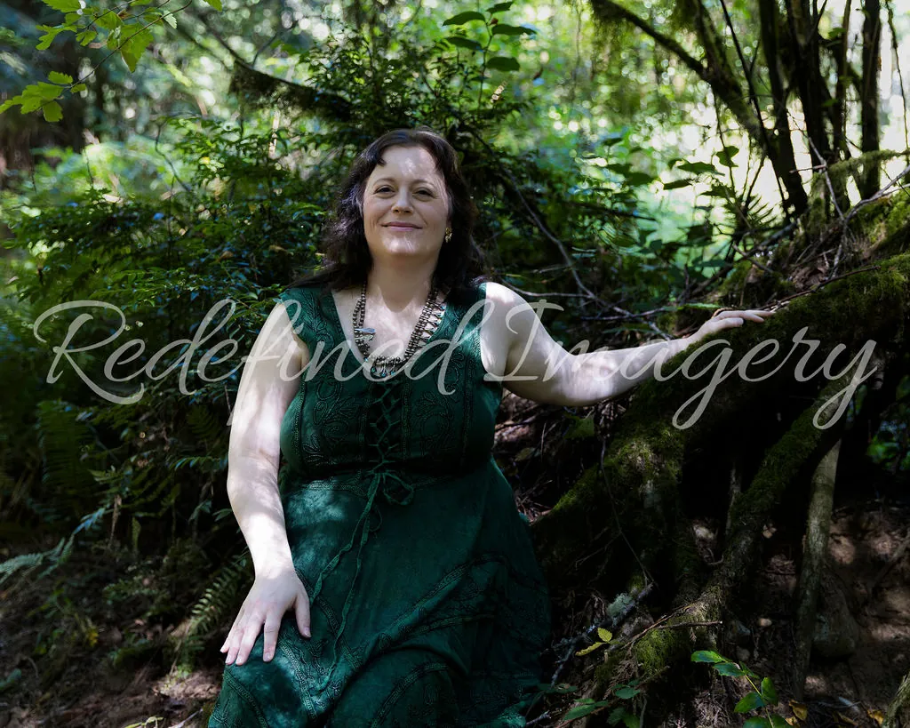 Morgan Nilsen sitting among ferns in a forest